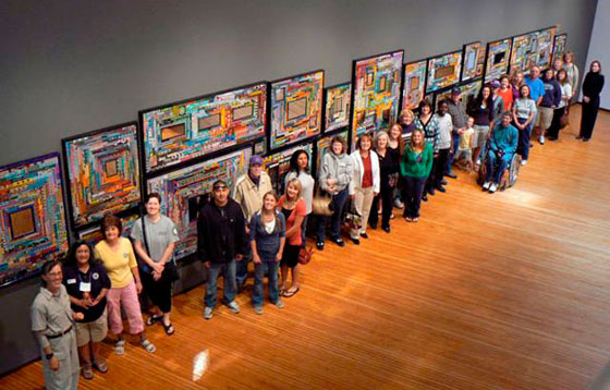 Jeanne Leffingwell and participants with the Million Bead Project installation