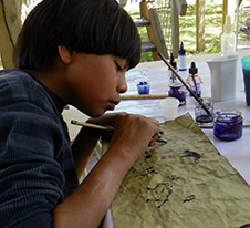 boy drawing at art camp