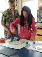 Jeanne helping a student with printmaking